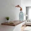 Vase décoratif bleu avec motif fleurs